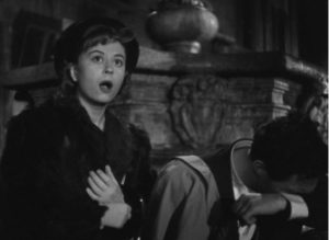 A still taken from “The White Sheik” where an open-mouthed Cabiria (Giulietta Masina) sits next to Ivan, who is crying.