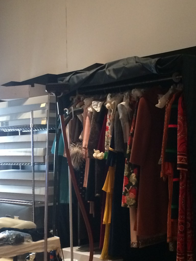 A rack of garments waiting to be photographed