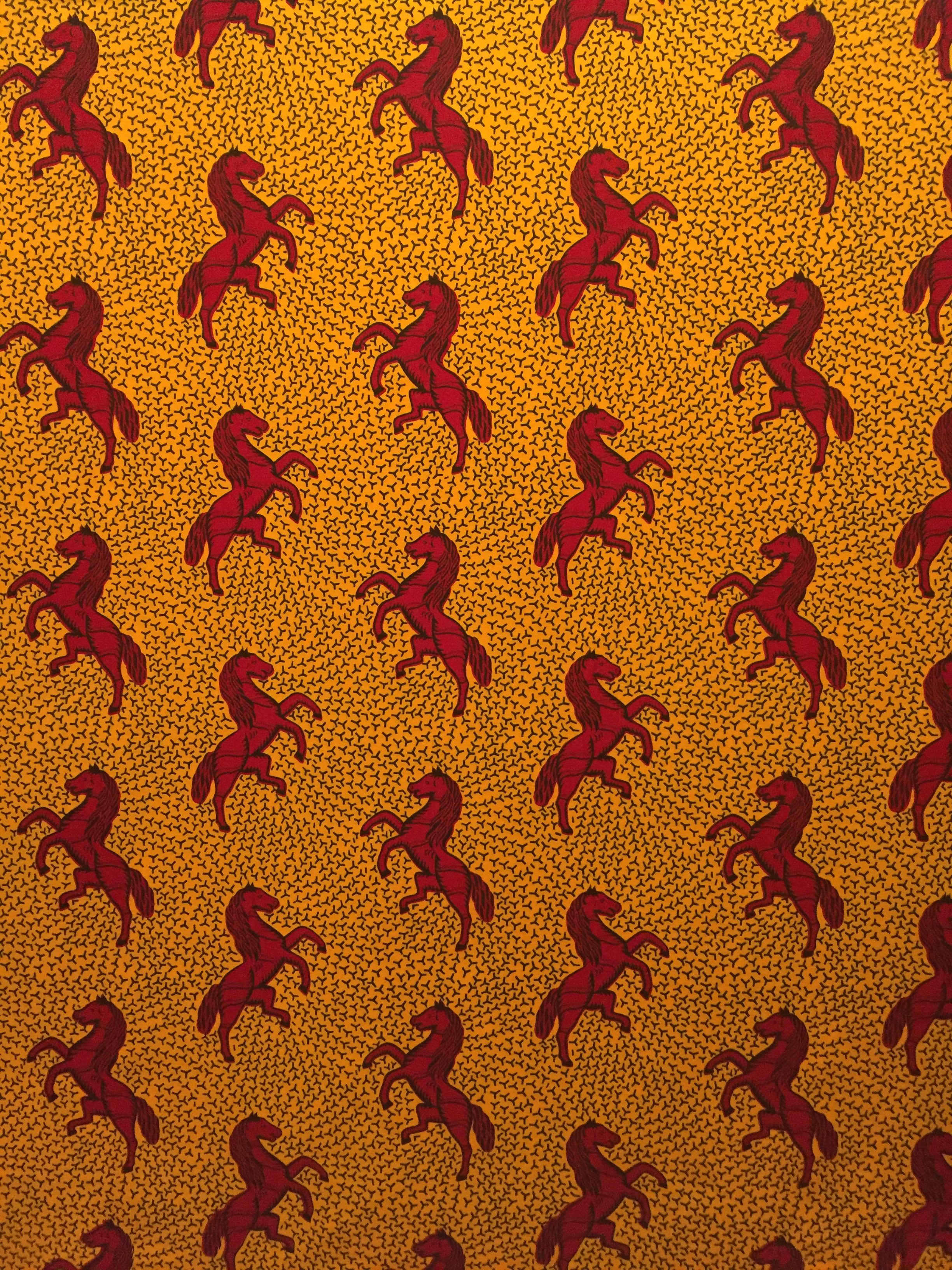 Textile. Designed by Haarlemsche Katoen Maatschappij - Haarlem Cotton Company. 1930; printed 1987. Cotton; wax block print. The names of many patterns identy with a womans family and marital relationships. In Côte d Ivoire, the classic Jumping Horse, also known as Je Cours Plus Vite Que Ma Rivale I - I Run Faster than my Rival - expresses the rivalry between co-wives. In Nigeria, Igbo women favor this design for Aso-Ebi - family cloth - to express unity at their annual womens meeting, held every August. 