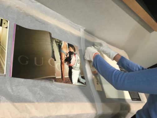 Installing the Gucci Ad in the exhibition
