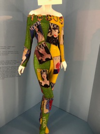 Mannequin wearing a tight body suit with covers of Vogue magazine printed on the fabric.