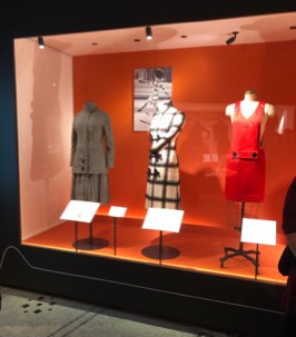 Museum vitrine with three mannequins dressed in Mary Quant dresses and coats