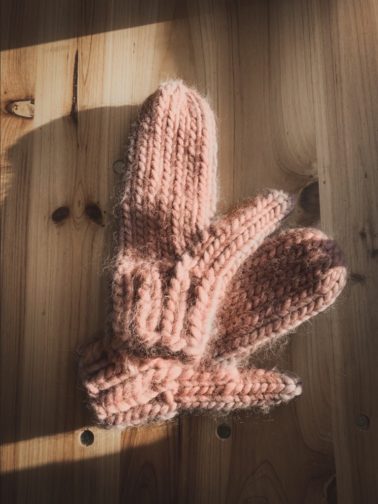 Pair of hand knitted mittens
