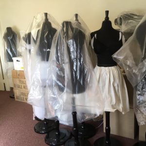A photograph documenting a collection of vintage mannequin's
