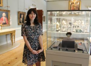 Eleanor Magson standing in front of the venetian glass bowl in the Courtauld's gallery
