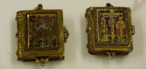 two closed pendants in the shape of books