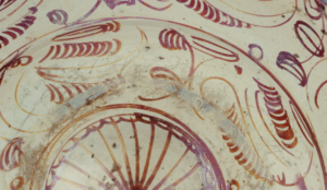Dish Tin-glazed earthenware, painted with lustre, detail decoration