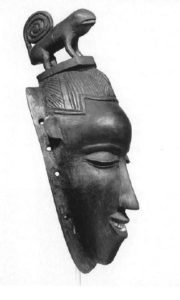 Sauli mask featuring a female head and a chameleon, side view