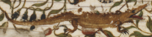 detail of a crocodile decoration on ivory casket