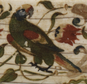 detail of a golder capped parakeet decoration on ivory casket