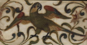detail of a green macaw decoration on ivory casket
