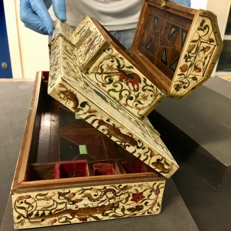 opened ivory casket side view