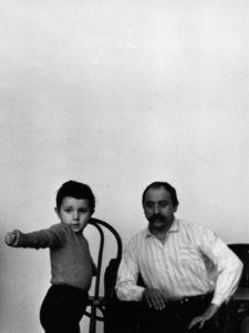 Artist Cesar posing for a photo with his young daughter Anna