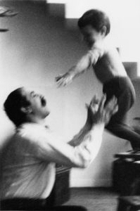 Artist Cesar throwing toddler son in air