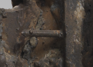 A close up image of César's Habitation sculpture, showing a nail sticking out of the sculpture