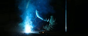 Electric Arc welder at work, blue sparks