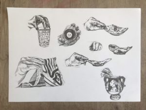 A hand drawn image of the four objects being held at different angles