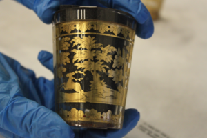 gold beaker with black insert