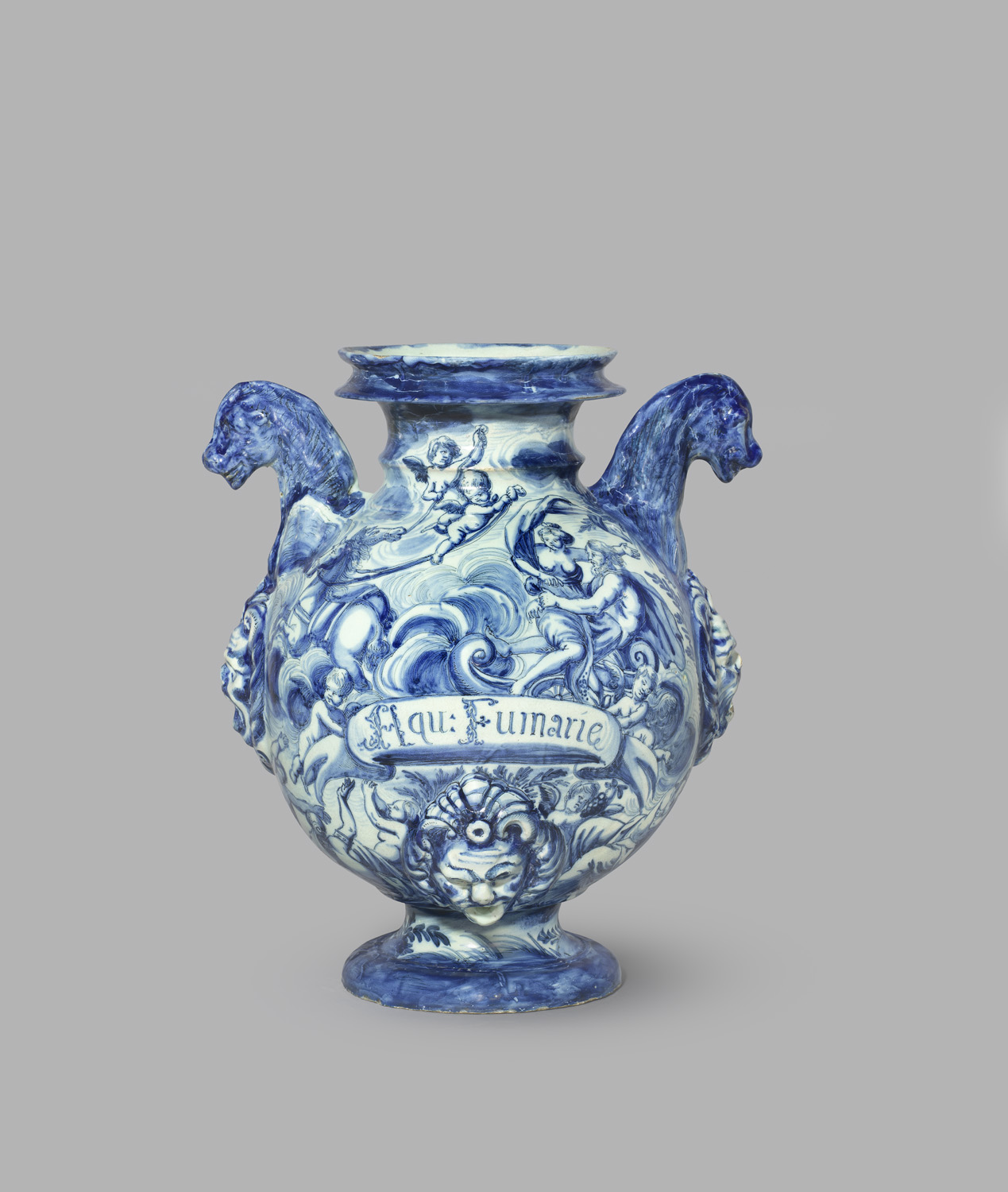 Blue and white pharmacy jar painted with abduction of Proserpina and an inscription saying 'water of fumitory'. The jar two handles and a top with edge.