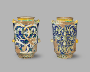 a yellow and blue glazed vase with inscriptions and decorations