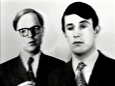 video still showing the artist duo Gilbert and George in black and white
