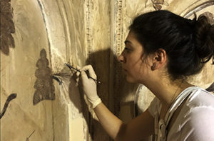 Eugenia Geddes da Filicaia restoring a wall painting