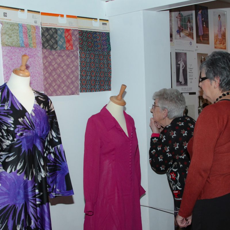 Visitors looking at fashion display at Braintree Museum